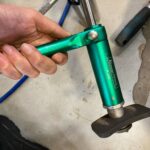 Close-up view of a pneumatic brake caliper piston tool used for efficient brake repairs." (This describes the image for accessibility and SEO purposes.