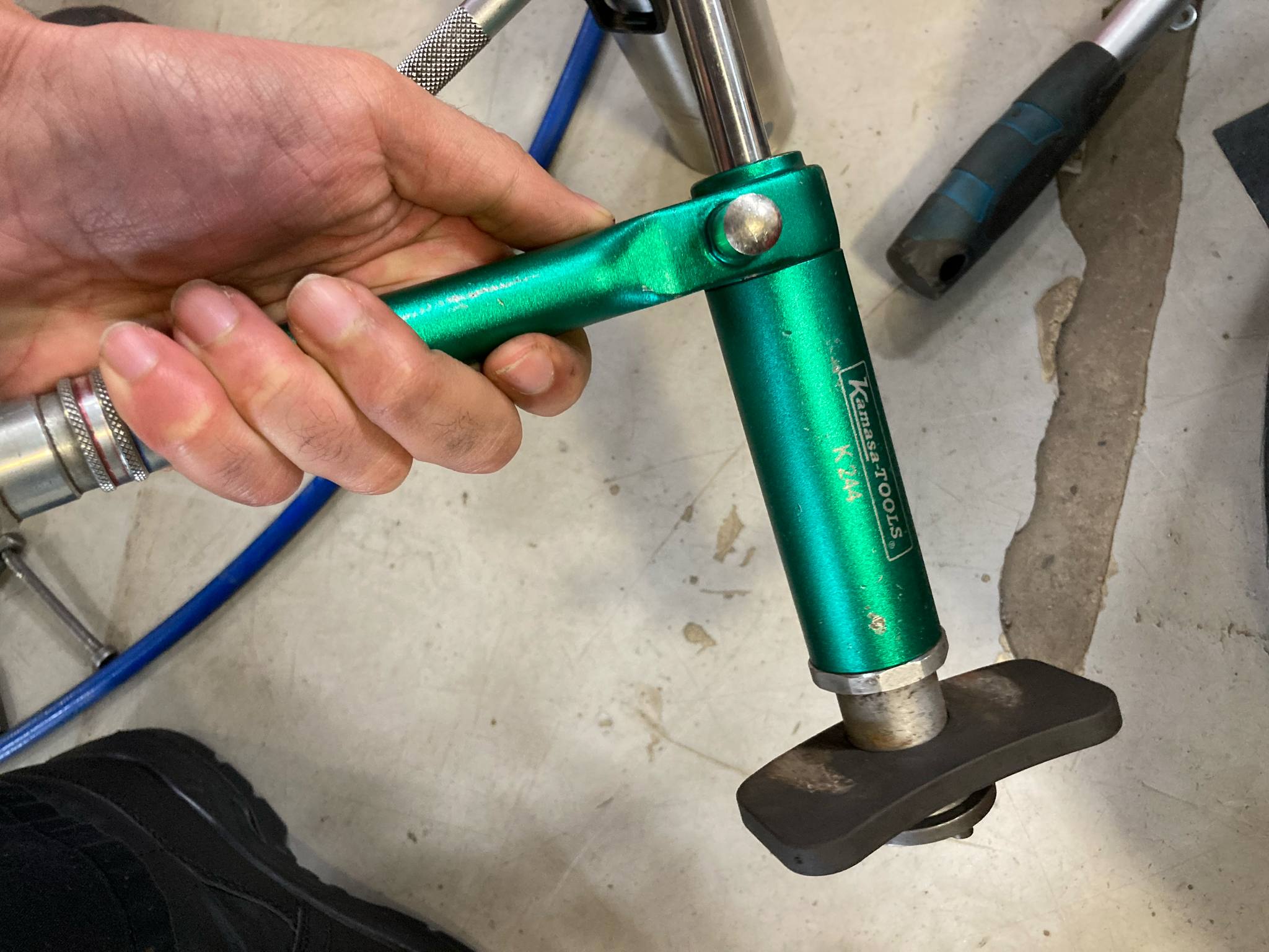 Close-up view of a pneumatic brake caliper piston tool used for efficient brake repairs." (This describes the image for accessibility and SEO purposes.